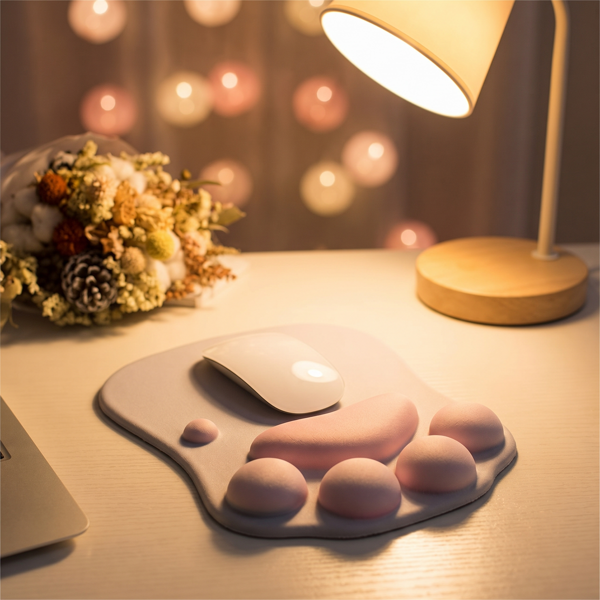 Anime mouse pad beside a glowing lamp