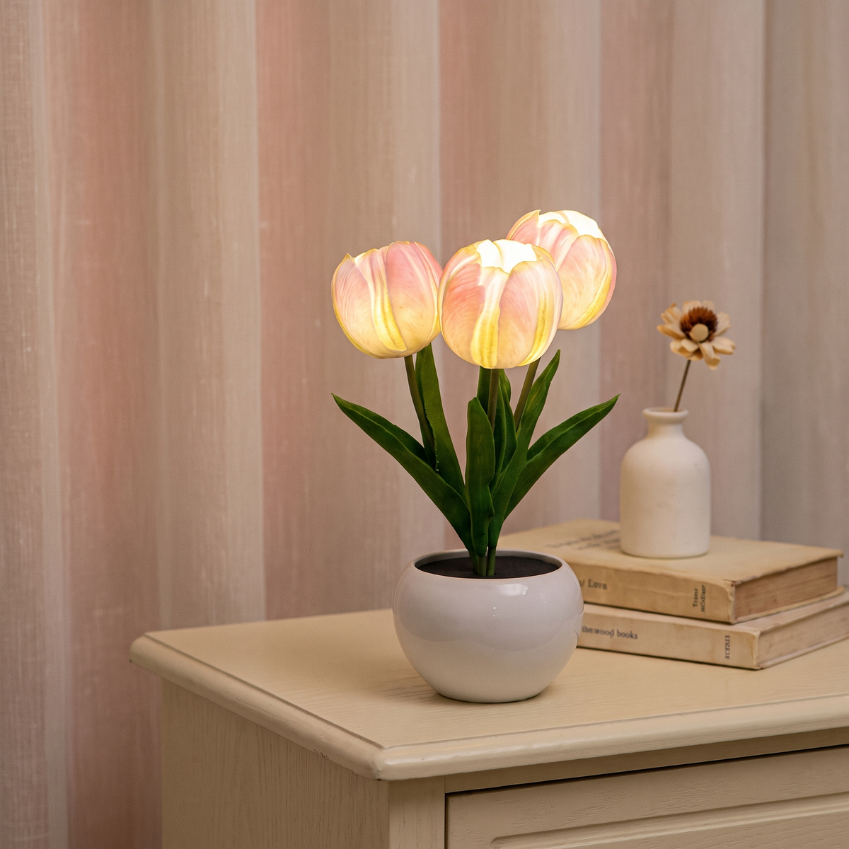 Tulip night light glowing on a nightstand