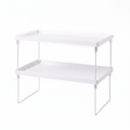 White desktop storage shelf on flat white