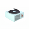 Retro vinyl record speaker on flat white